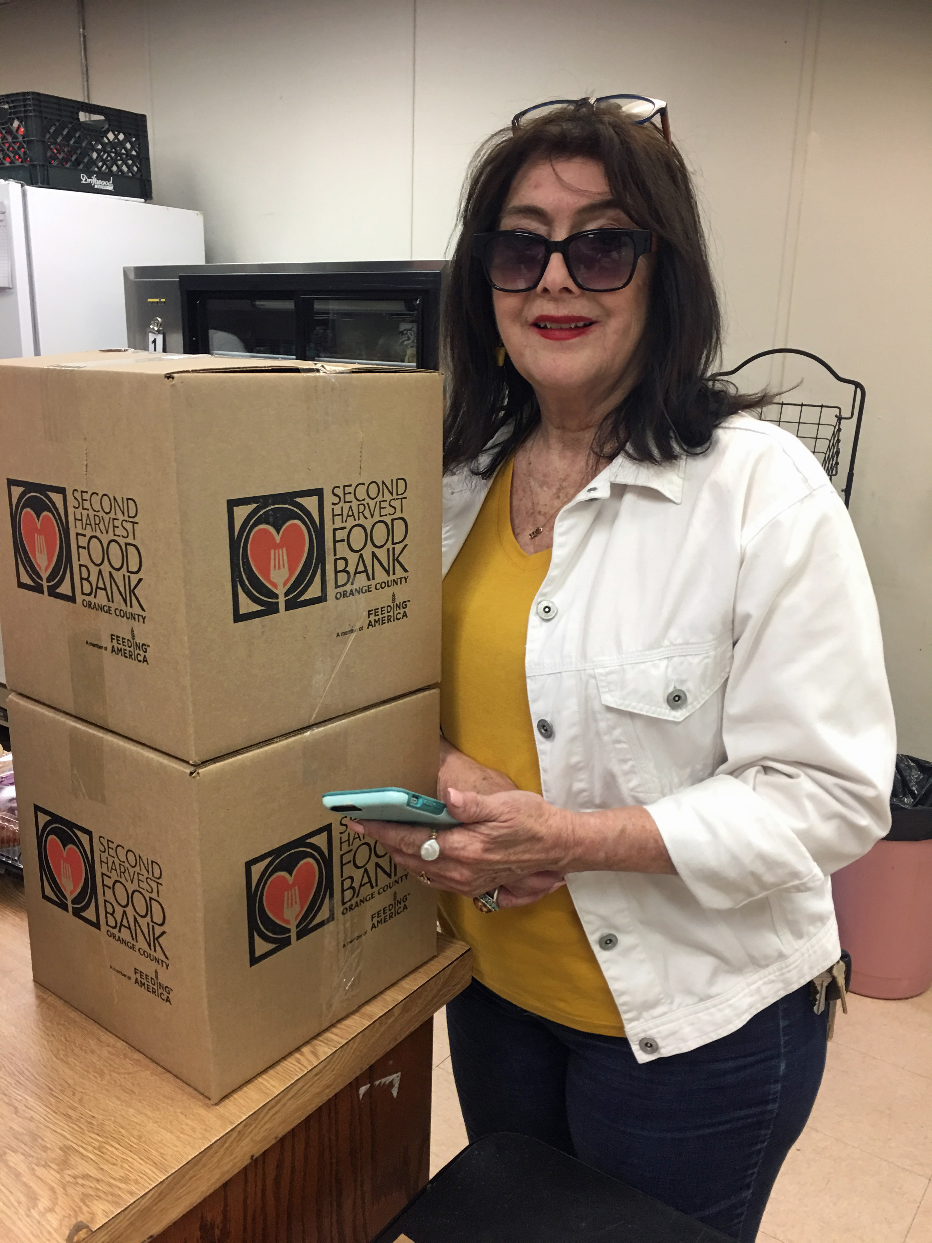 Rose lifts donated food boxes
